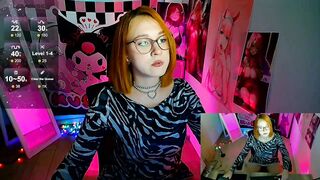 margaret_red - Young girl teasing in front of the camera and sweet-talking.