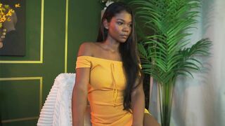 astrea_1 - Mulatto dances a striptease on camera and communicates in a beautiful dress.