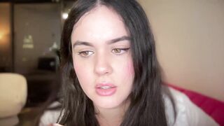 gia_is_horny -Clothed young woman teases in front of the camera and shows her sweet tits