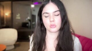 gia_is_horny -Clothed young woman teases in front of the camera and shows her sweet tits